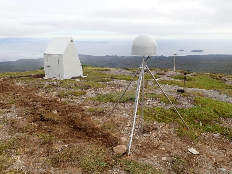 Installation of AVO's new seismic and GNSS network at Mt. Edgecumbe volcano, August 20-29 2023.  Station EDCR on Crater Ridge, view to SE.  The temporary GPS antenna mast in the back right was partially knocked over in the winter of 22-23, so we replaced it with a much more durable welded steel monument made of four 12 ft rods driven into the ground.