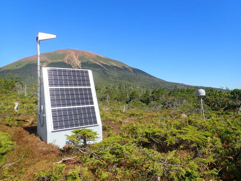 AVO installed three new seismic / GNSS stations in a small network around Mt Edgecumbe volcano in late August 2023.  View (to NNE) of the completed geophysical monitoring site EDSO with Mt Edgecumbe in the background.  This station has a directional cellular link to Biorka Island.