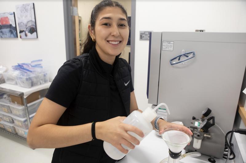 ANSEP intern Haley works in the Alaska Tephra Lab at the Alaska Volcano Observatory, August, 2022.