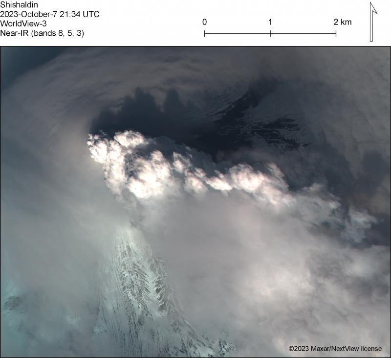 Steam and gas plume visible above low clouds at Shishaldin Volcano on October 7, 2023, from a near-infrared WorldView-3 satellite image. Pyroclastic deposits from October 3 are visible to the northeast of the steam plume. 