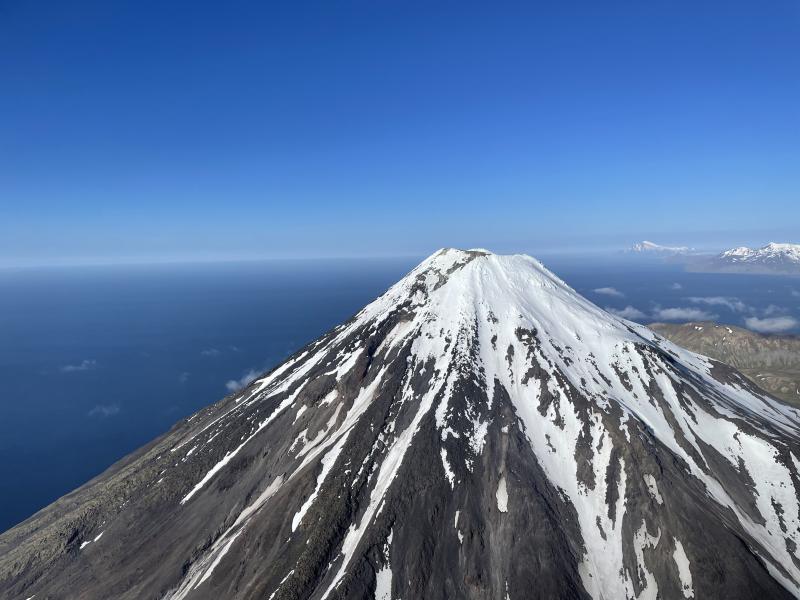 Kanaga summit fly-by; the northern end of Adak Island and Great Sitkin are visible in the background.