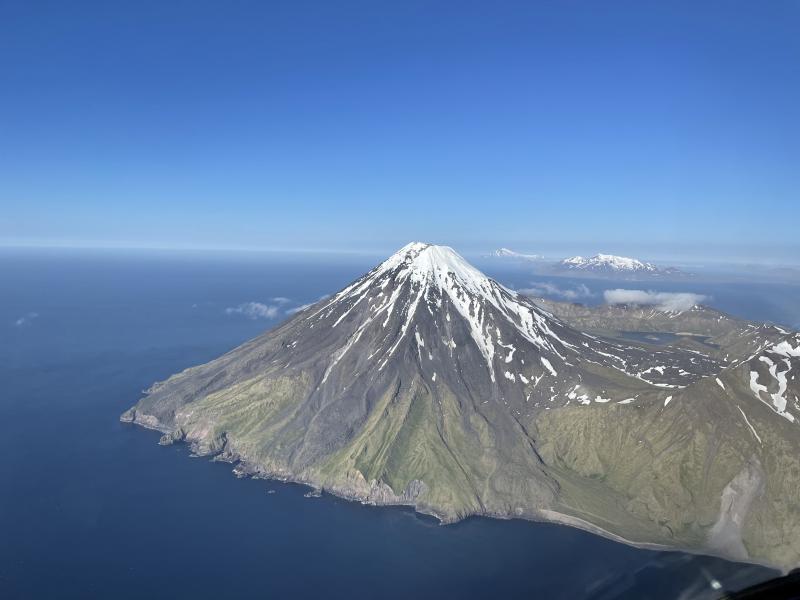 Kanaga fly-by; Adak Island and Great Sitkin are visible in the background.