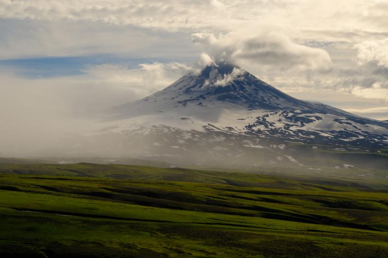 Shishaldin Volcano viewed from the northeast. Strong winds through the pass between Shishaldin Volcano and Isanotski Peaks prevented collecting 2024 eruption samples on Shishaldin on this day.