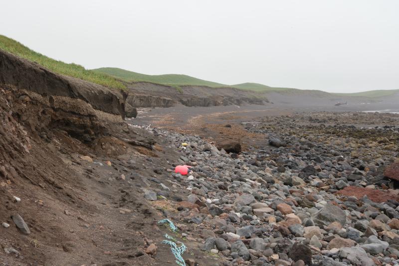 Coastal exposure on Cape Lapin north of Shishaldin Volcano at station 24SHML03. Here the Fisher caldera forming eruption deposits overly the Cape Lapin debris avalache.