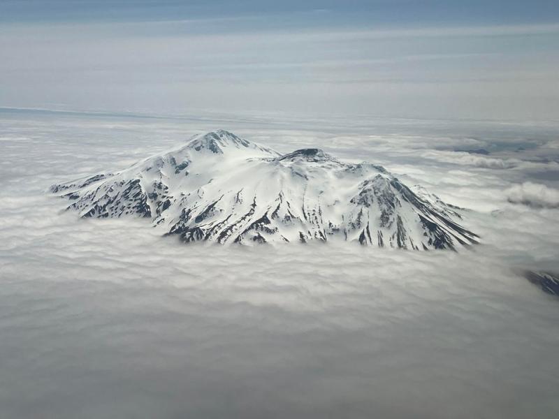Aerial photo of Great Sitkin Volcano, taken from the northwest. The active part of the lava dome and flow is snow free.
