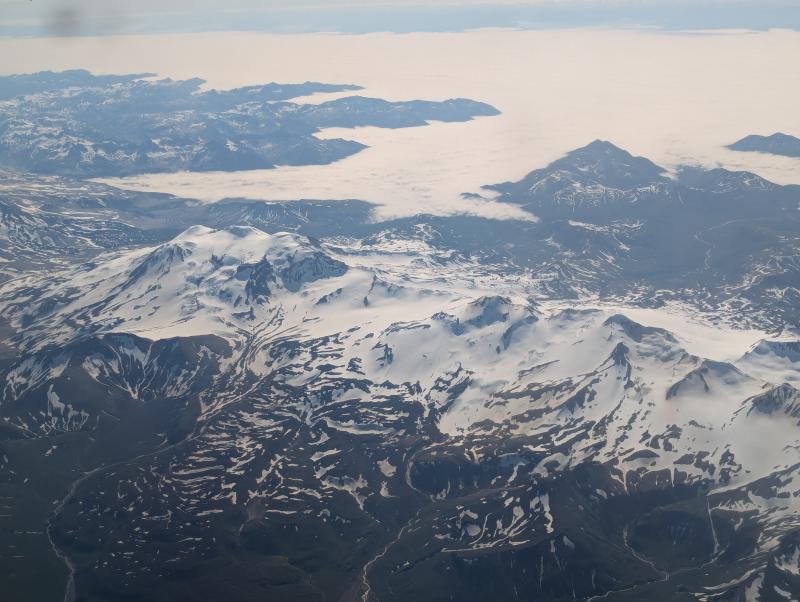 View of Mageik (left) and Martin (middle-right) Volcanoes from the north, en route to Cold Bay aboard a commercial flight on July 22, 2024.