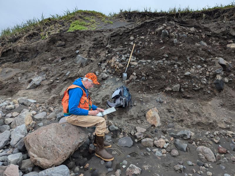 AVO geologists examine a coastal exposure at Lapin Cape, north of Shishaldin Volcano, during the 2024 summer fieldwork on Unimak Island.