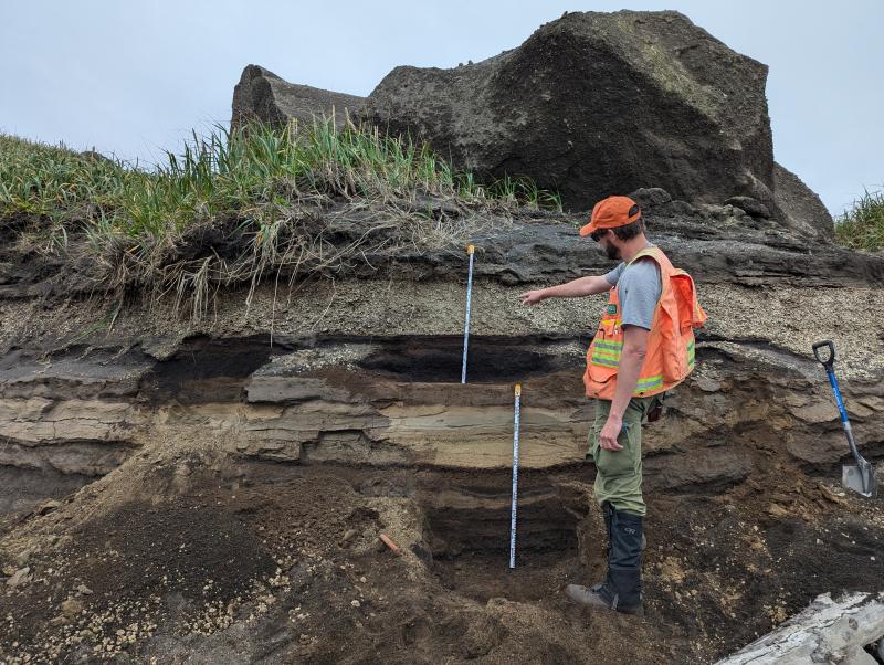 AVO geologists examine a coastal exposure at Lapin Cape, north of Shishaldin Volcano, during the 2024 summer fieldwork on Unimak Island.