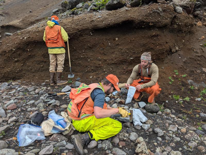 AVO geologists collecting rock samples during 2024 fieldwork on Unimak Island