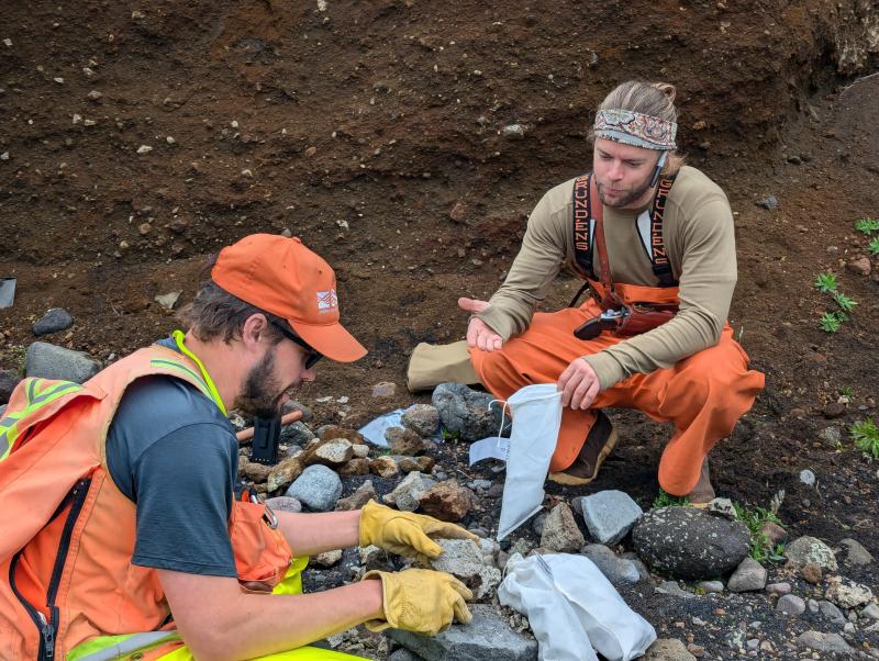 AVO geologists collecting rock samples during 2024 fieldwork on Unimak Island