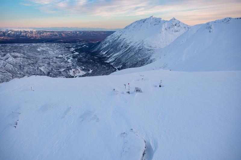 Alaska Volcano geophysics and webcam station SPCR on December 18, 2024, looking down the Chakachatna River valley beyond. 