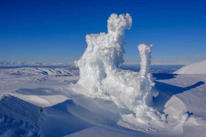 Heavy rime ice and snow cover of AVO geophysics station SSN on Mount Susitna on February 7, 2025. AVO field crews visited the site to remove rim ice from solar panels to improve charging and install alternate satellite telemetry to improve data flow from the Spurr volcano network.