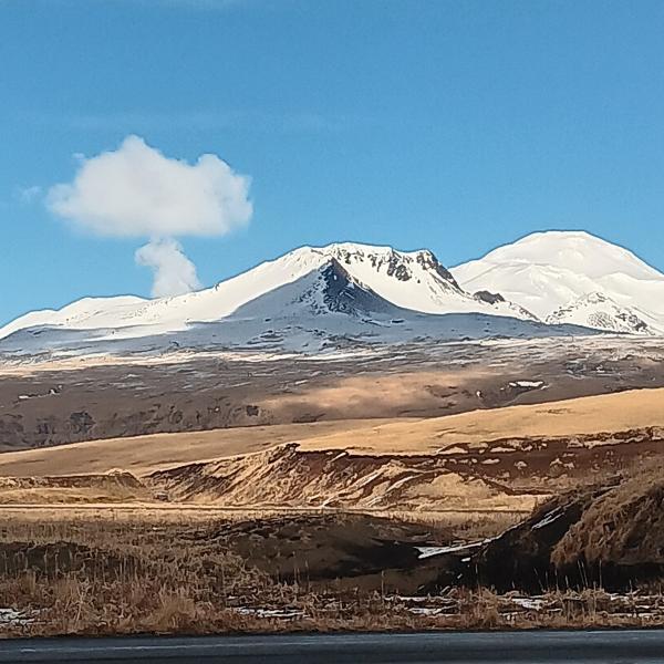 Steam rising from Korovin Volcano's crater lake (lake not visible from this perspective) as seen from the vicinity of Atka.