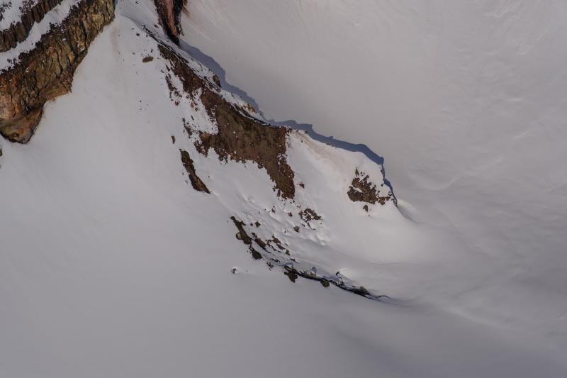 View towards the north of a ridge inside the Crater Peak crater. This ridge has been the source of subtle fumarolic activity and carbon dioxide emissions starting in February 2025. 