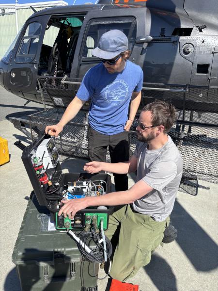 Alaska Volcano Observatory staff set up equipment to measure volcanic gas compositions before an overflight of Mount Spurr on May 23, 2025.