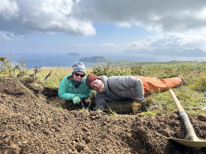Hannah Dietterich &amp; Jordan Lubbers pause during seismometer replacement at Great Sitkin site GSMY during 2025 Korovin Geophysics project.