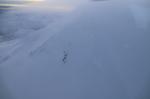 Small fumarole field on the north side of the summit cone of Mount Spurr. Taken during a summit overflight on December 18, 2024.